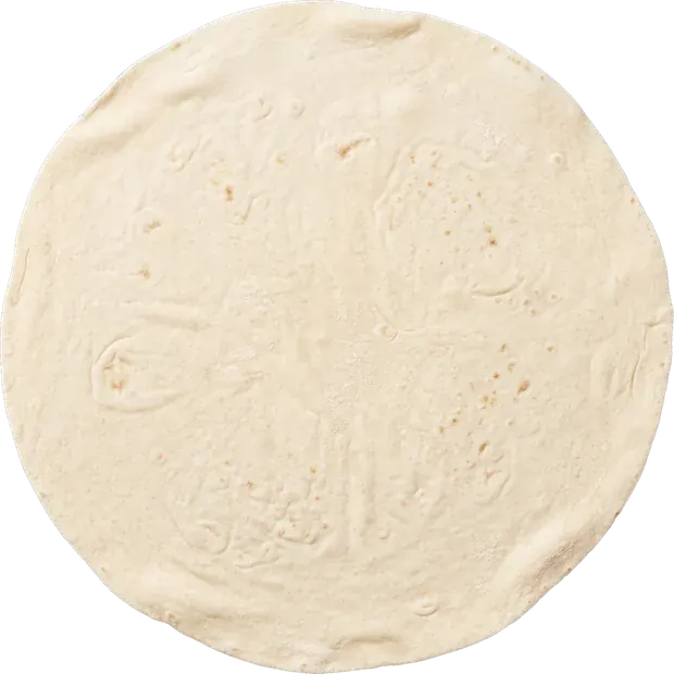 A single round yufka sheet, cut out, with the baking pattern on it